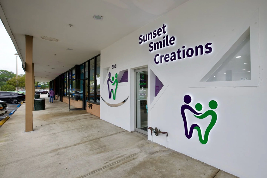 Street entrance and exterior signage at the Sunset Smile Creations Sunrise office.